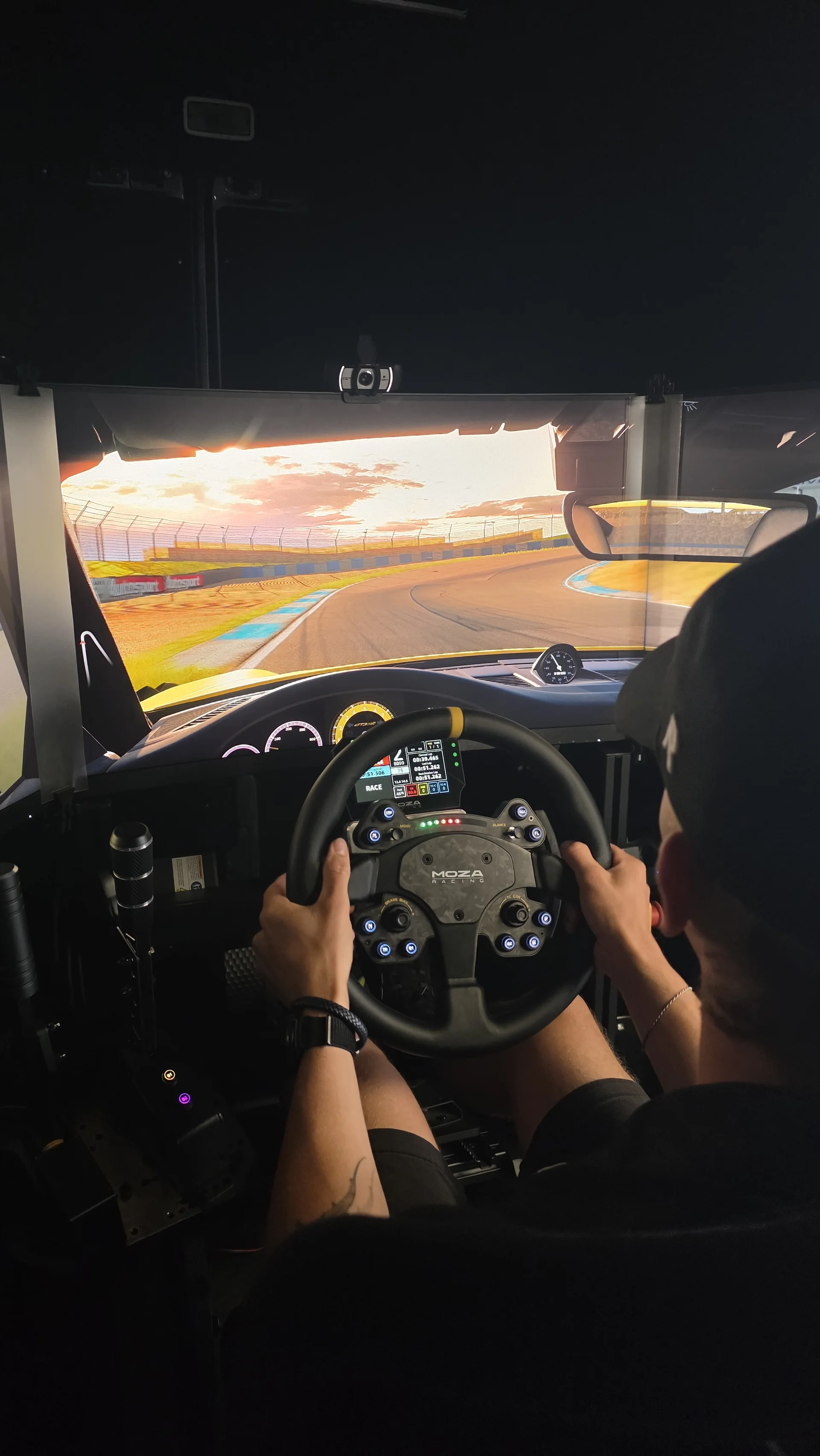 SIR Motorsport triple-screen racing simulator in use at an event