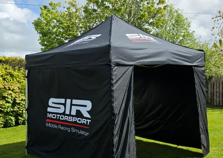 SIR Motorsport branded event tent at an outdoor private hire setup.