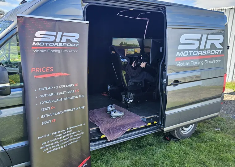 SIR Motorsport mobile simulator van setup with branded event banner